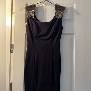 Size small Guess black dress with fun sleeve detail! Stretchy fabric!